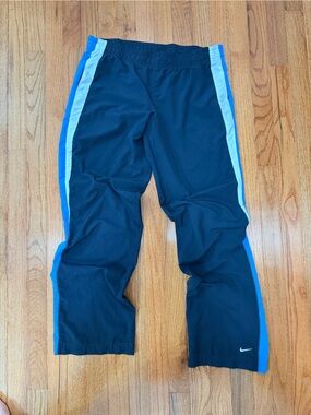 Nike Black Track Pants with Blue Side Stripes